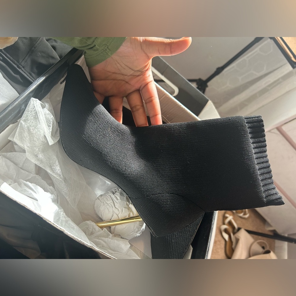 A black sock fit pointed toe booties
